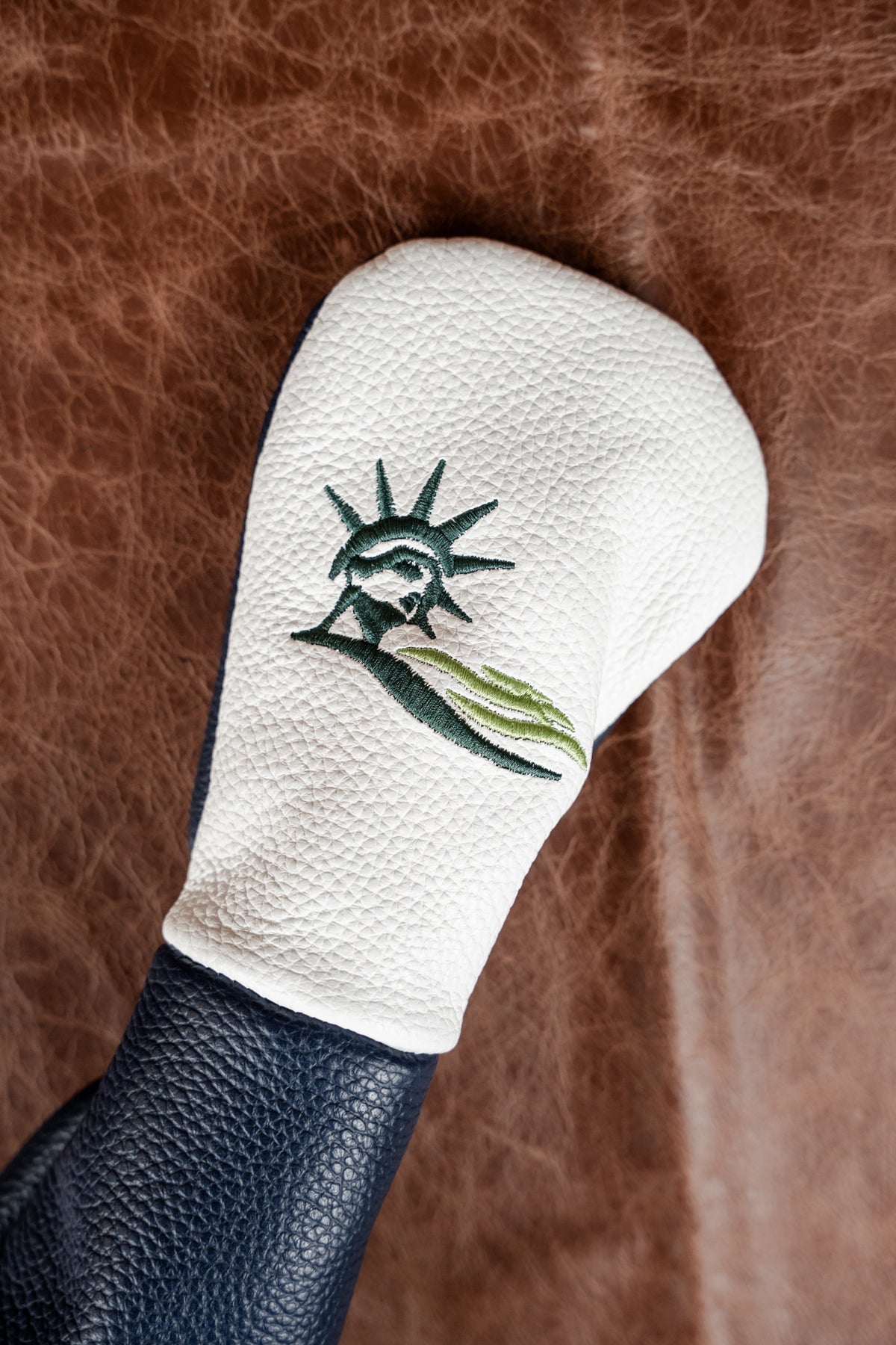 Liberty National shop stock white headcover with embroidered logo